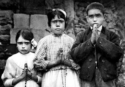 Children (Seers) of Fatima Lucia Santos, Jacinta Marto, Francisco  Marto holding their rosaries. (1917 A.D.)